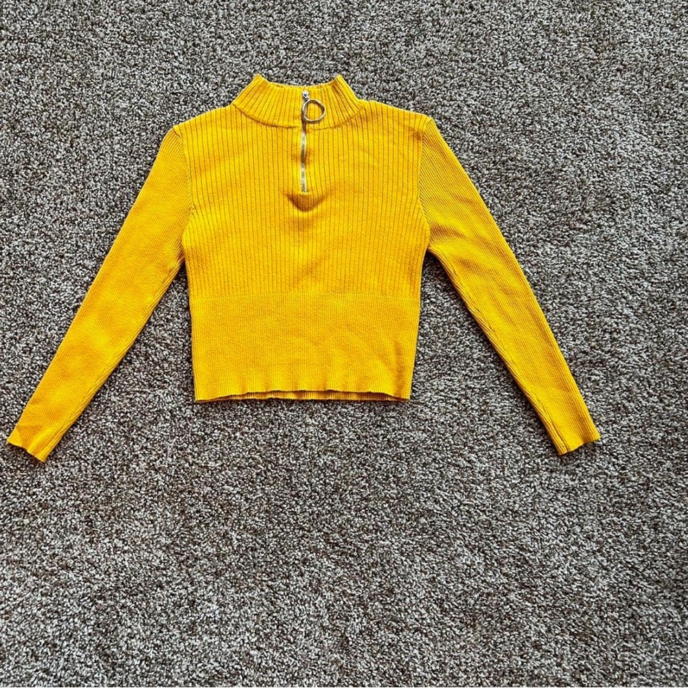 Yellow cropped sweater.